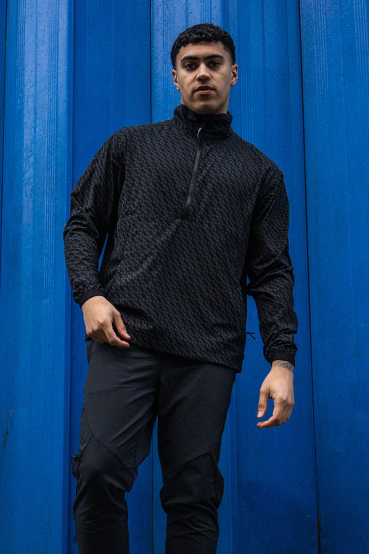 Streetwear active half zip with all over tonal logo print.