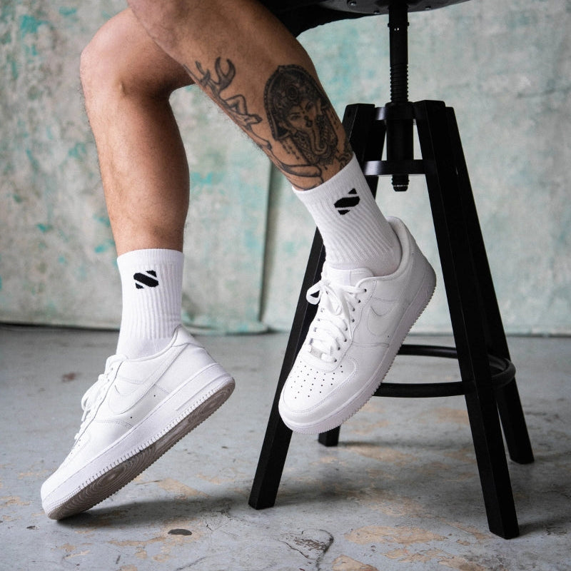 White sport socks with Supremebeing logo in black